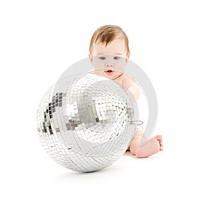 Adorable baby boy with big disco ball