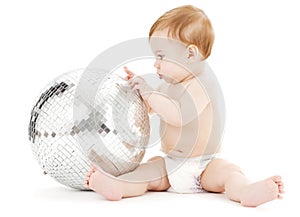 Adorable baby boy with big disco ball