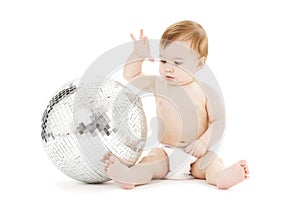 Adorable baby boy with big disco ball