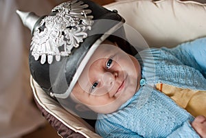 Adorable baby boy in German spicked helmet