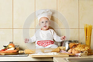 Adorable baby boy in kitchen