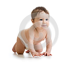 Adorable baby boy learning to crawl. Cute child crawling on floor. Kid isolated on white background