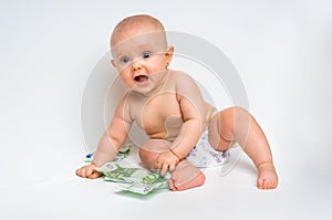 Adorable baby with euro bills money - isolated on white