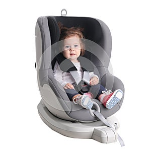 Adorable baby girl in child car safety seat