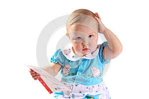 Adorable baby girl holding a card