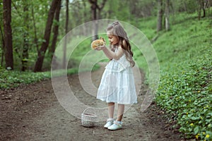 Adorable baby girl with a little rabbit