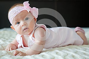 Adorable baby girl in pink dress