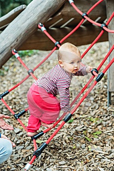 Adorable baby girl playing outside