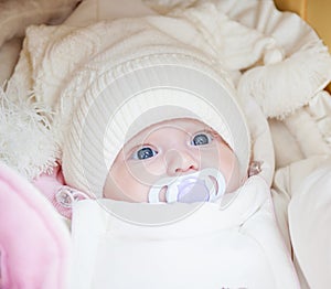 Adorable baby girl wearing winter hat