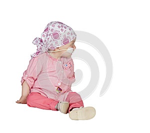 Adorable baby with a headscarf beating the disease