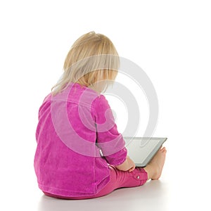 Adorable baby sit with tablet computer on white