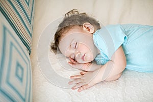 Adorable baby sleeping and having sweet dreams