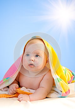 Adorable baby with sun and sky