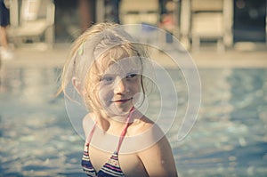 Adorable blond girl in swimsuit portrait