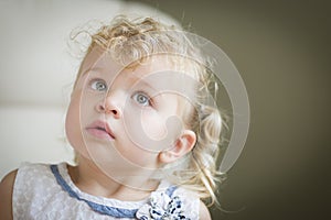 Adorable Blonde Haired and Blue Eyed Little Girl in Chair