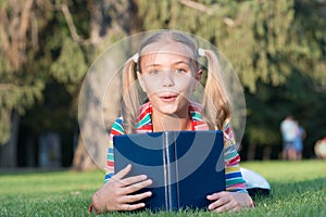 Adorable bookworm. School time. Developing caring learners who are actively growing and achieving. Little child reading