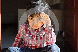 Adorable boy in checked shirt cheerful child happy kid student