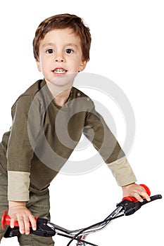 Adorable boy cycling