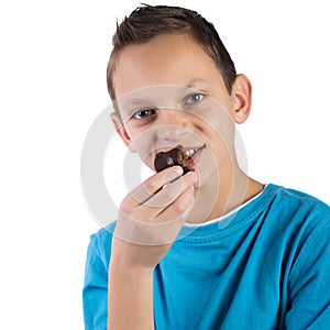 Adorable boy eating cookies