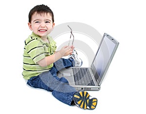 Adorable Boy With Glasses Working On Laptop Over White