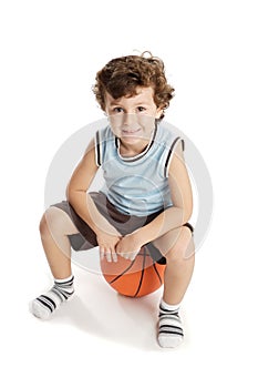 Adorable boy playing the basketball
