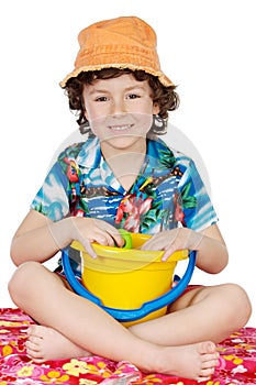 Adorable boy playing in the beach