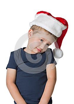 Adorable boy in red cap of Santa Claus