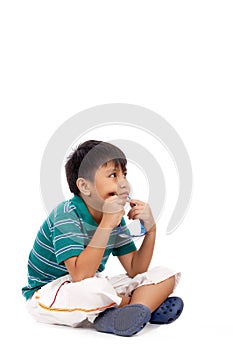 Adorable boy thinking