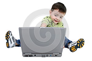Adorable Boy Working On Laptop Over White