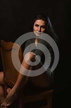 Adorable brunette woman sitting in studio during model tests, dr