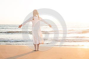 Adorable Child Little Girl Looks at the Sky and Sea