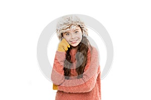 Adorable child long hair soft fur hat. Child care concept. Girl long hair wear fur hat white background. Winter shampoo