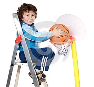 Adorable child playing the basketball