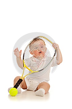 Adorable child playing with tennis racket racket