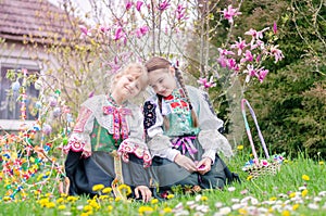 Adorable children in Easter traditional folk costumes in Slovakia, Europe