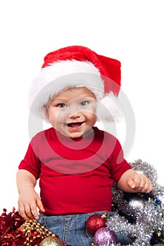 Adorable christmas child in a red hat