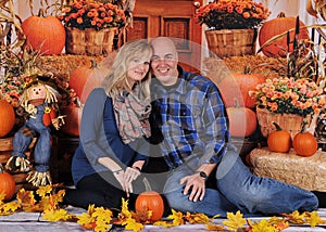 Adorable couple with colorful fall backdrop