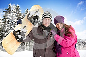 Adorable couple enjoying in wintertime photo