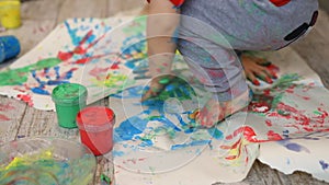 Adorable cute caucasian little blond siblings children enjoy having fun together with mother painting brush and palm at