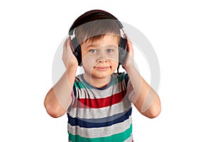 Adorable cute child enjoying favorite songs using wireless headphones. isolated on white background. Leisure, music and