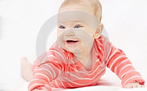 Adorable cute little girl with big blue eyes and wide smile play