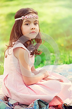 Adorable dressy child girl in spring garden photo
