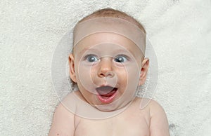 Adorable excited smiling baby open mouth laughing