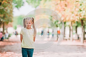 Adorable fashion little girl outdoors in the Tuileries Gardens, Paris