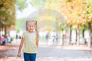 Adorable fashion little girl outdoors in the Tuileries Gardens, Paris