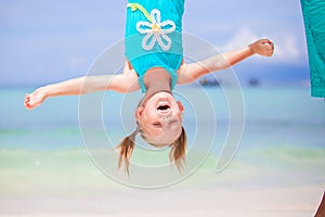 Adorable funny little girl outdoors during summer vacation have fun with her young father