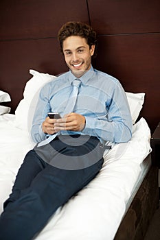 Adorable gentleman reading text sms on phone