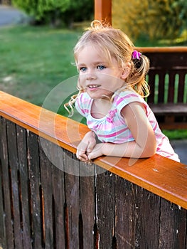 Adorable girl child looks straight ahead with curiosity. Portrait of young caucasian female child. Kid face with pretty eyes and