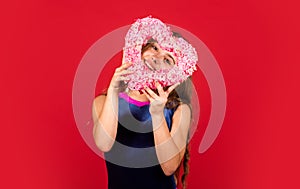 Adorable girl having fun. Romantic mood. Happy child hold heart red background. Little girl with pink heart. Heart