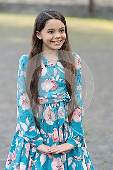 Adorable girl long hair smiling face urban background outdoors, fancy look concept